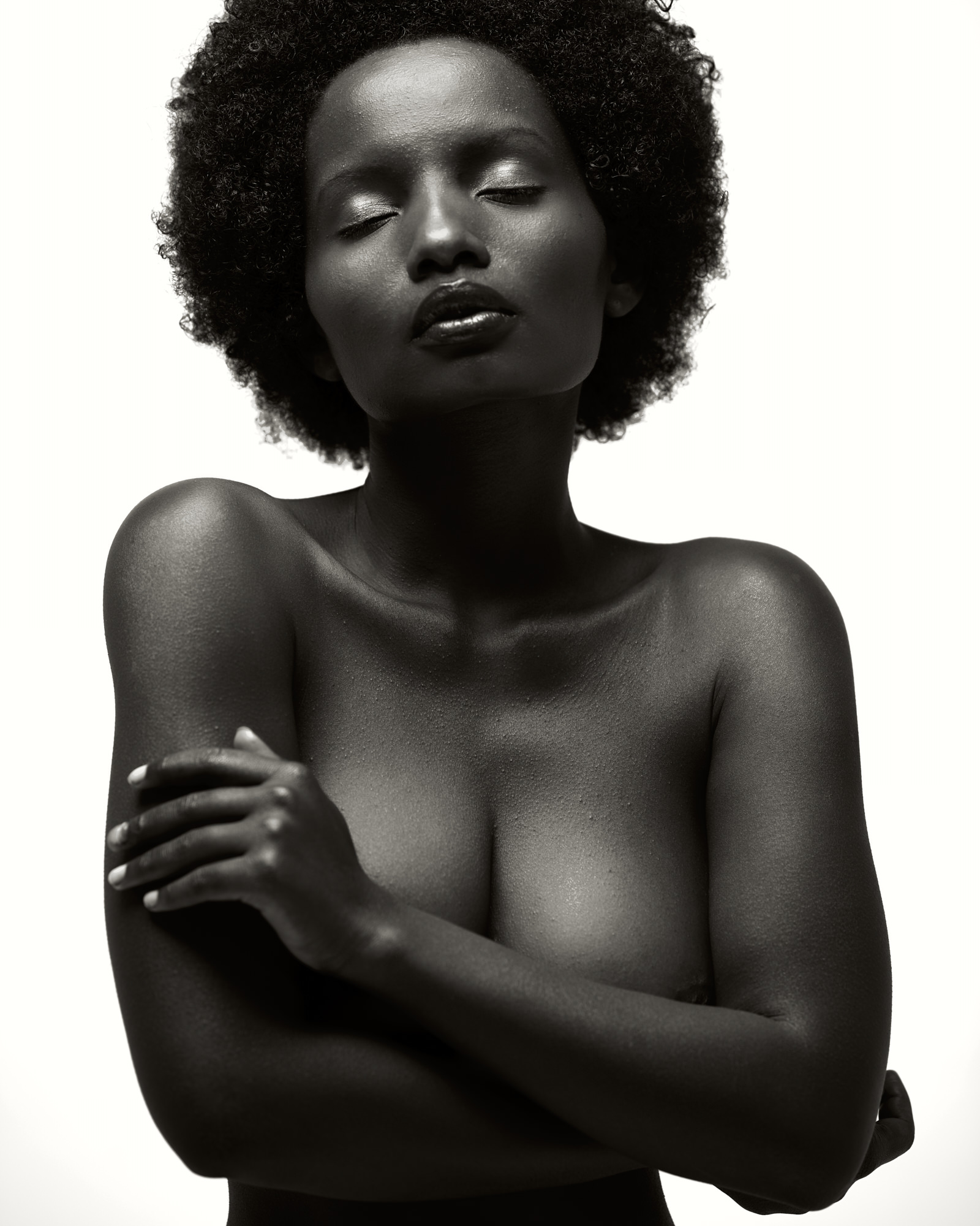 Close black and white portrait with still sculptural presence