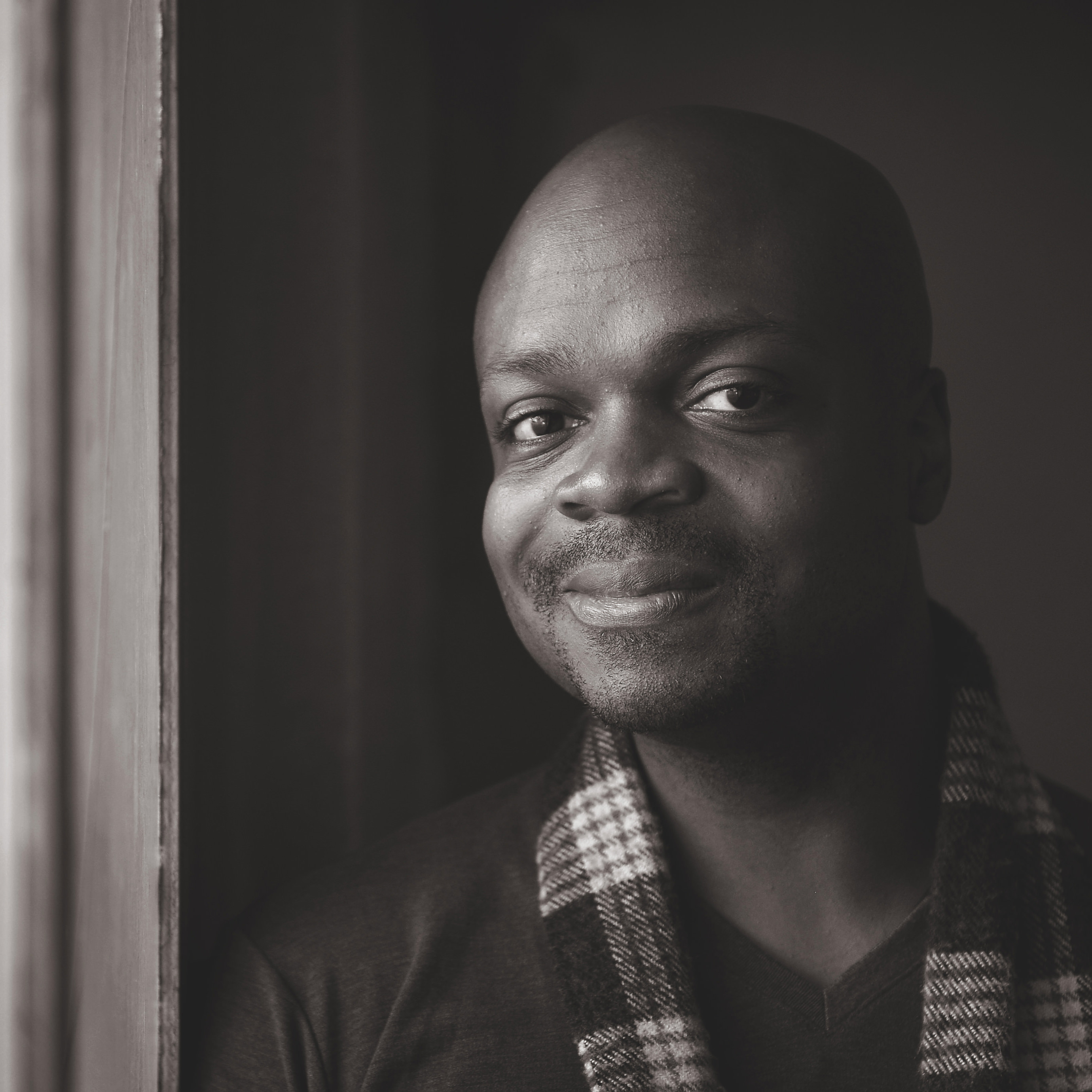 Kofi Amoa in black and white light