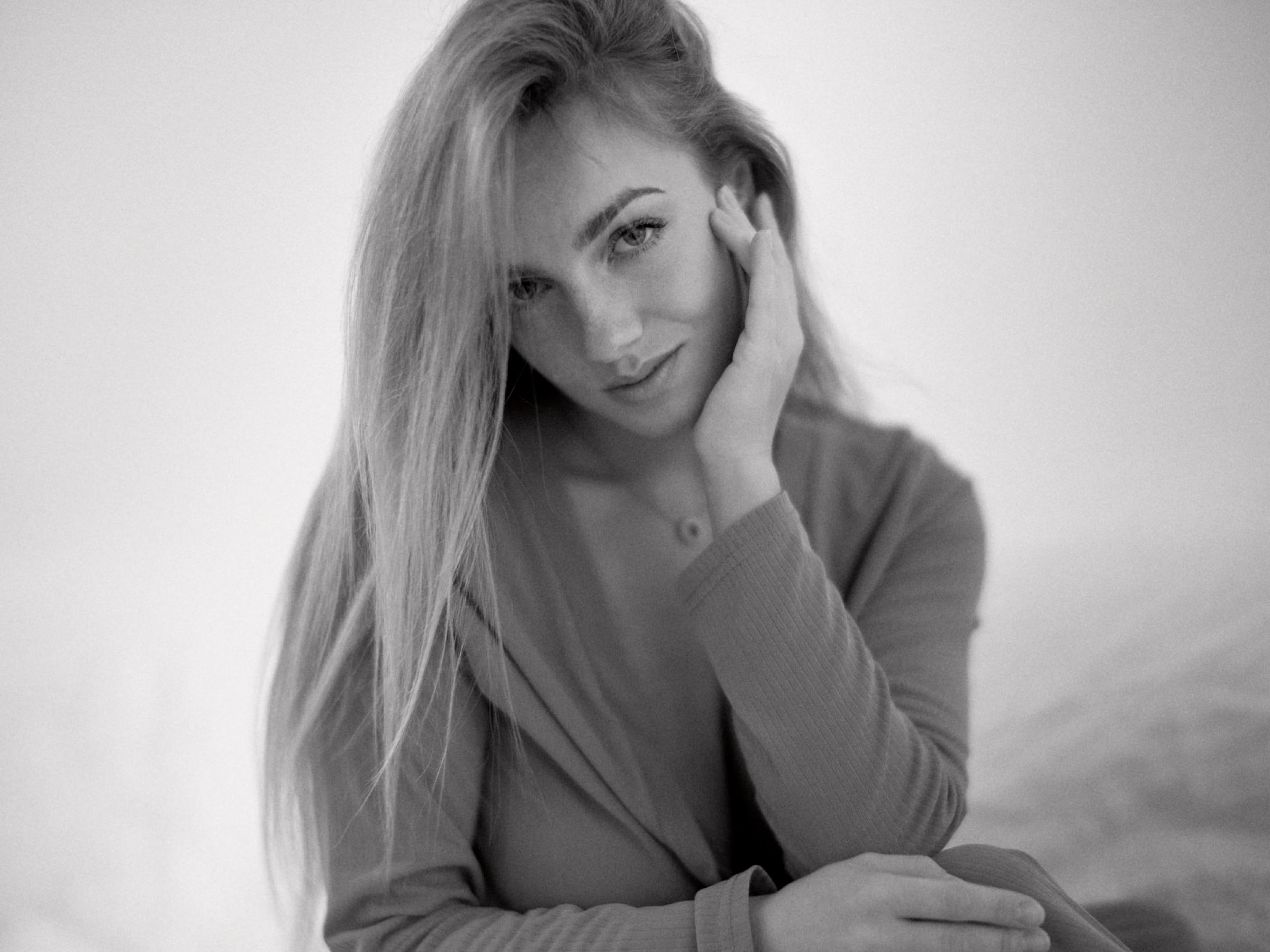 Anastasia standing in black and white