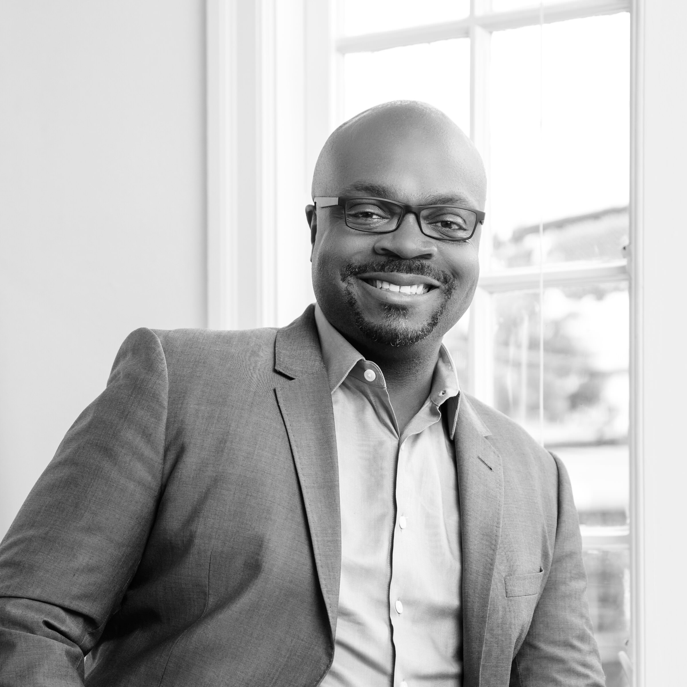 Black and white portrait of Kofi Amoa