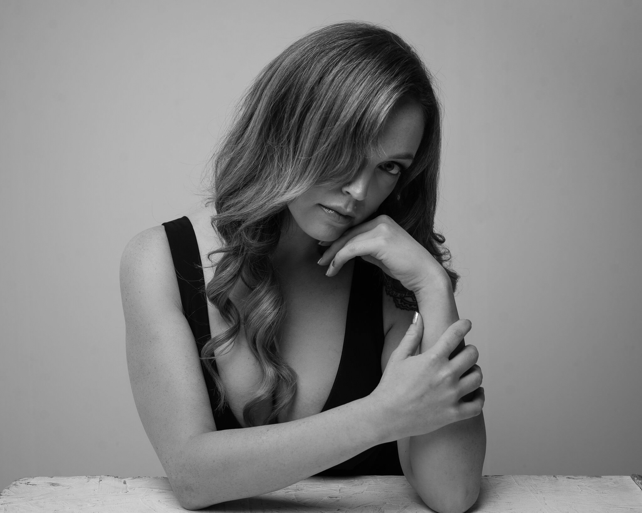 Quiet seated black and white portrait