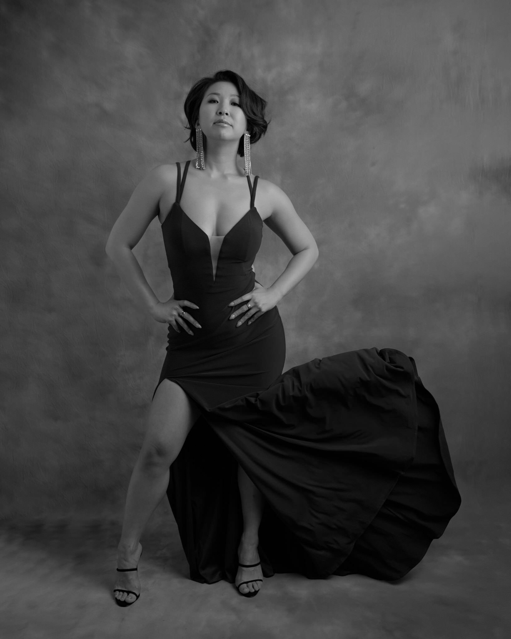 Black and white studio portrait in evening dress