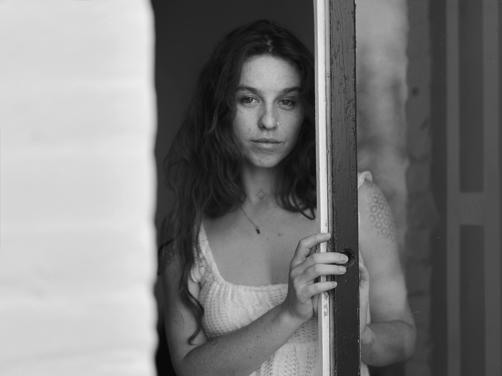 Kisa black and white portrait at the doorway